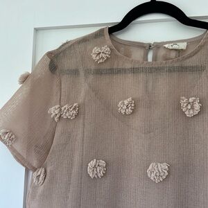 Entro peplum pompom top